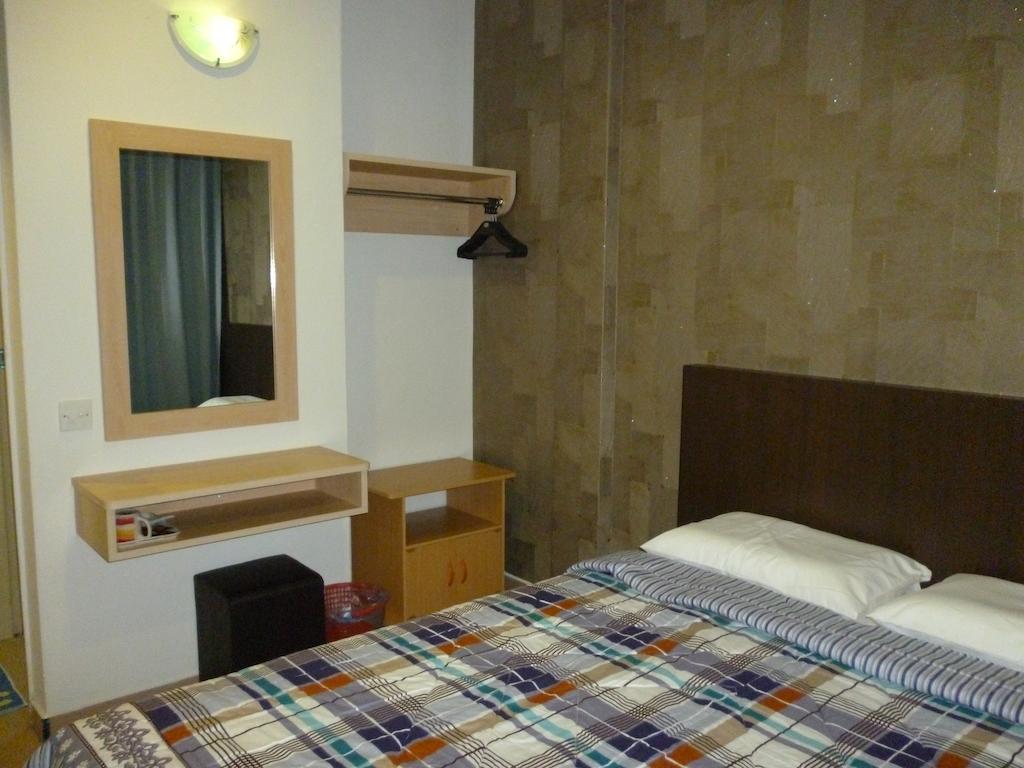 G Six Hotel Sitiawan Værelse billede